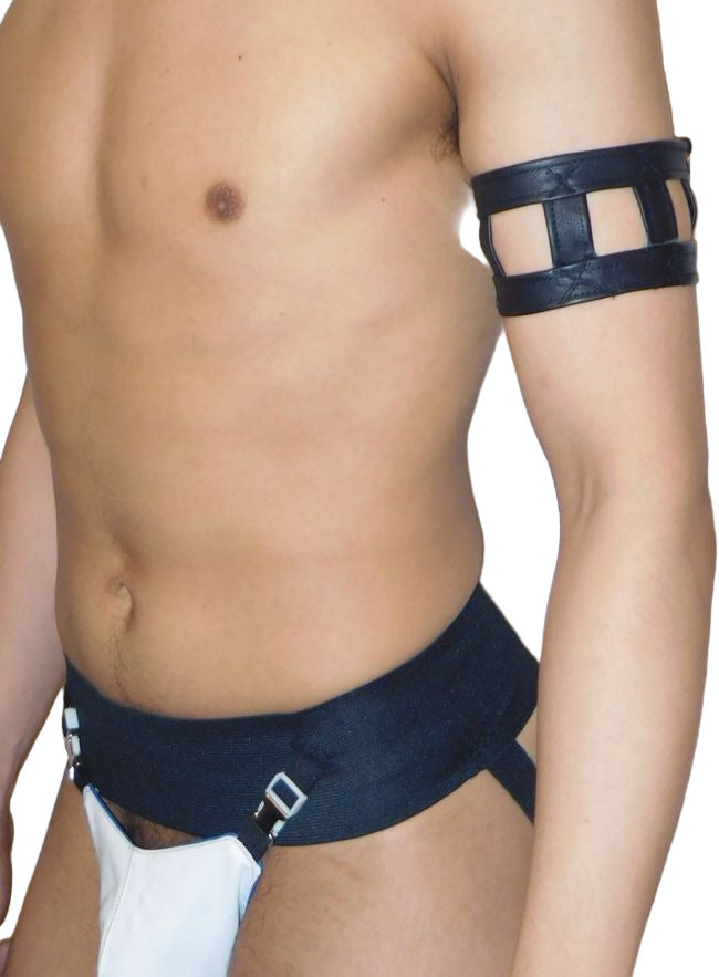 Man wearing a black leather harness with a white background