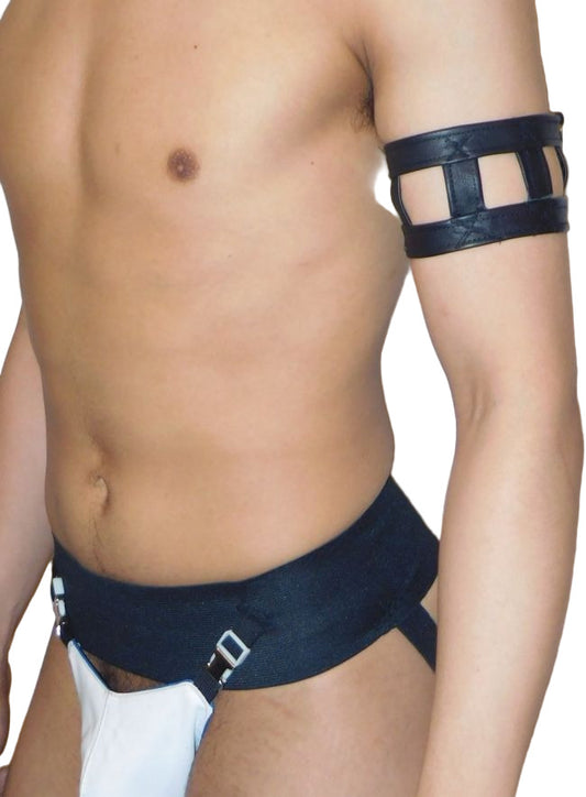 Man wearing a black leather harness with a white background