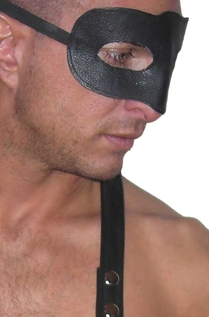 Man wearing a black leather mask on a white background