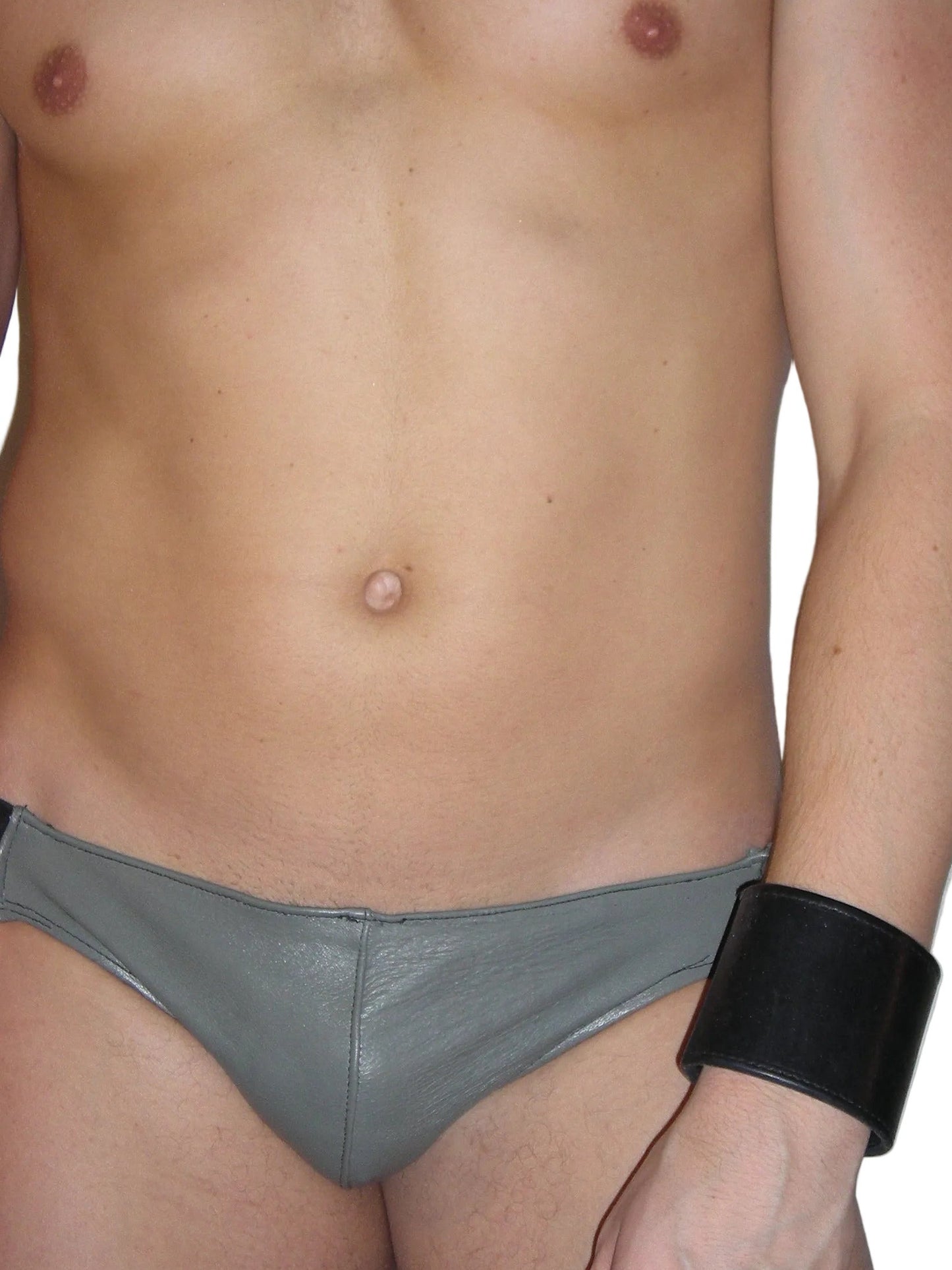 Partial view of a person wearing gray underwear with a black wristband on a white background